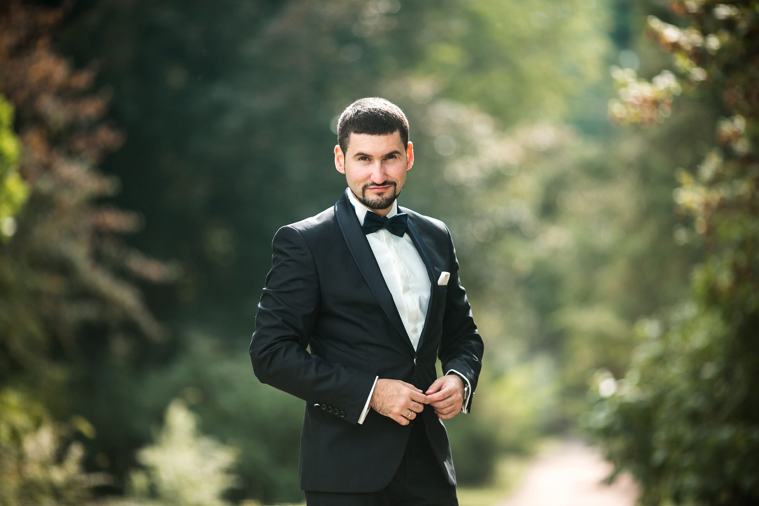 elegant-groom-posing-outdoors